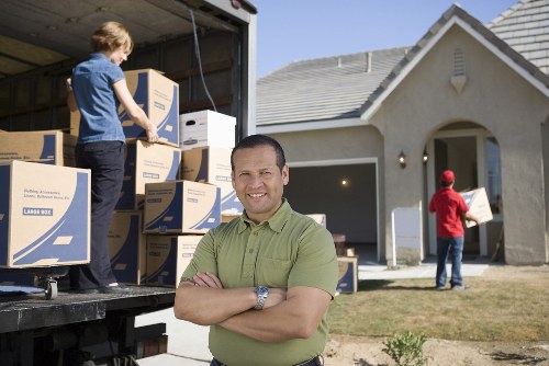 Loading furniture into a moving truck for an Enfield move