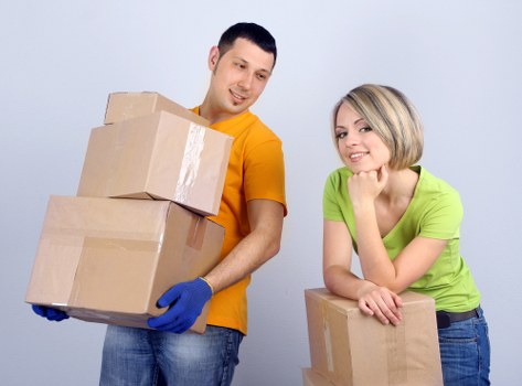 Packed moving boxes and furniture prepared for transport by Enfield movers