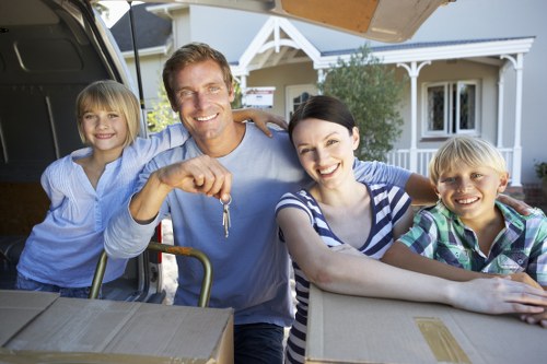 Local movers handling furniture during a house move in Enfield