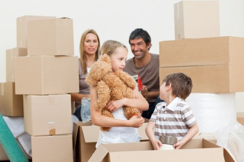 Careful loading of household items for transport in Enfield